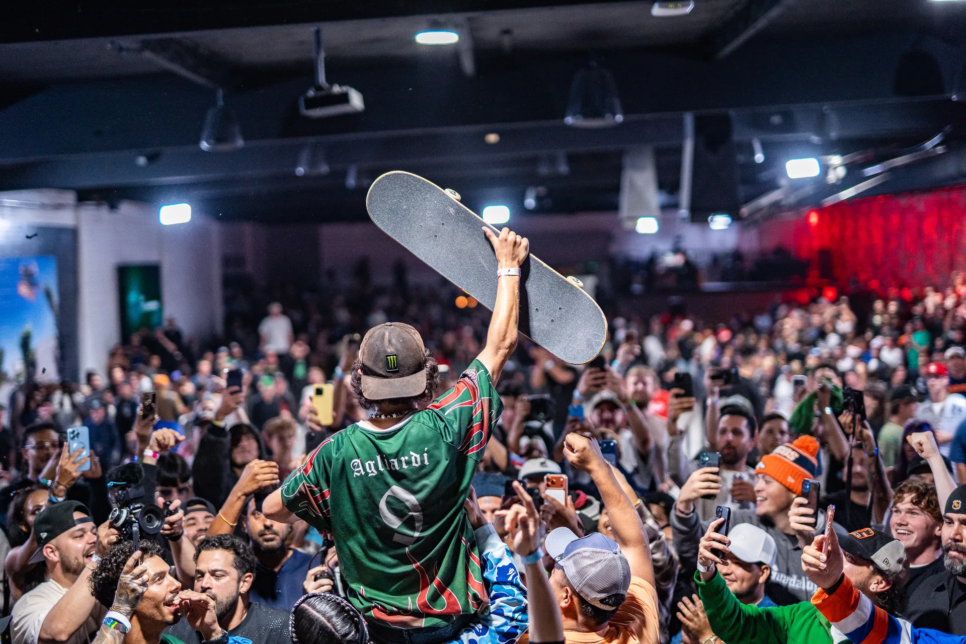 SHS celebrates its 2026 PSL Finals victory with the crowd, raising a skateboard overhead.